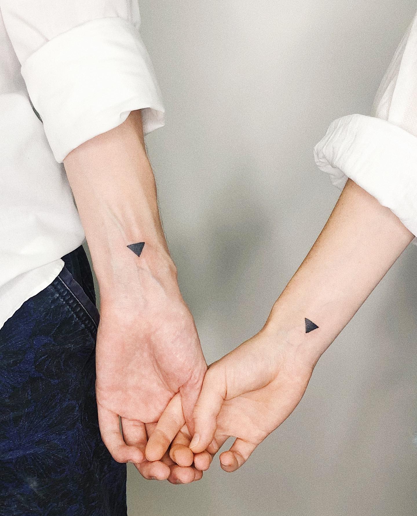 Matching triangles tattoos